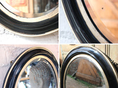 A Decorative c.1880 Ebonised Oval Wall Mirror