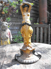 A Beautiful Painted Cast Iron Figural Door Stop of a Scantily Dressed Lady