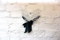 A Good Quality Masquerade Ball Mask in the Form of Butterfly Wings with Skull Decoration