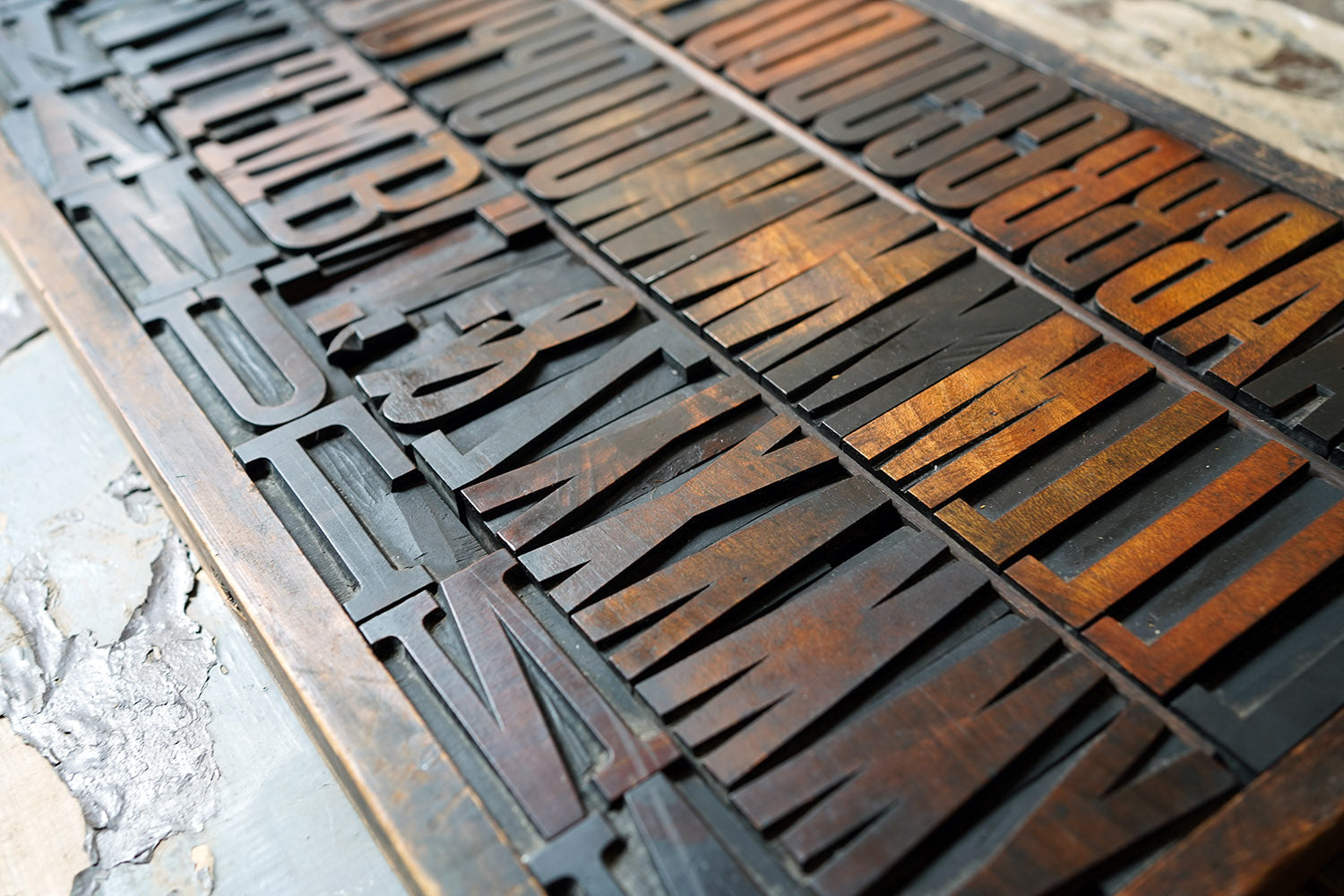 A 19thC Alphabet Tray of Wooden Letterpress Printing Blocks c.1895