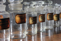 A Fantastic Group of Nine Early 20thC Clear Glass Chemist's Jars
