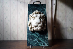A 20thC Alabaster and Serpentine Marble Lion's Mask Wall Plaque