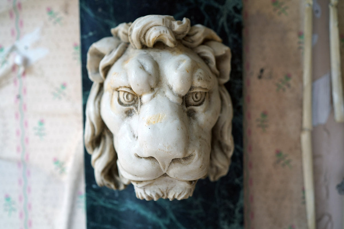 A 20thC Alabaster and Serpentine Marble Lion's Mask Wall Plaque