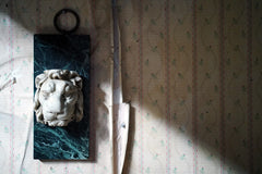 A 20thC Alabaster and Serpentine Marble Lion's Mask Wall Plaque
