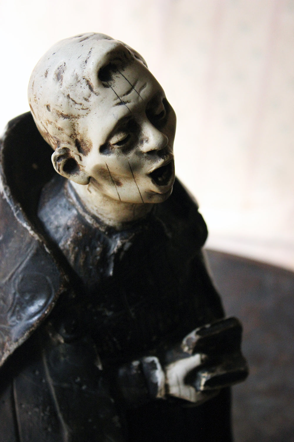 A 19thC Italian Painted Ceramic Figure of a Chanting Monk