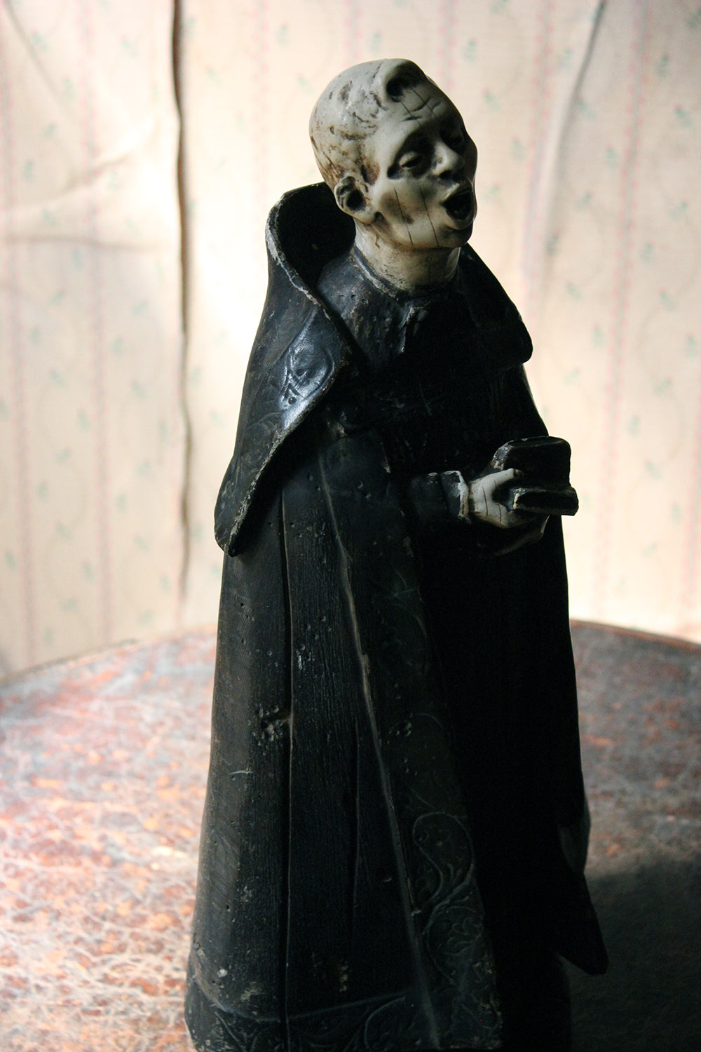 A 19thC Italian Painted Ceramic Figure of a Chanting Monk