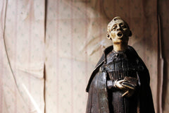 A 19thC Italian Painted Ceramic Figure of a Chanting Monk