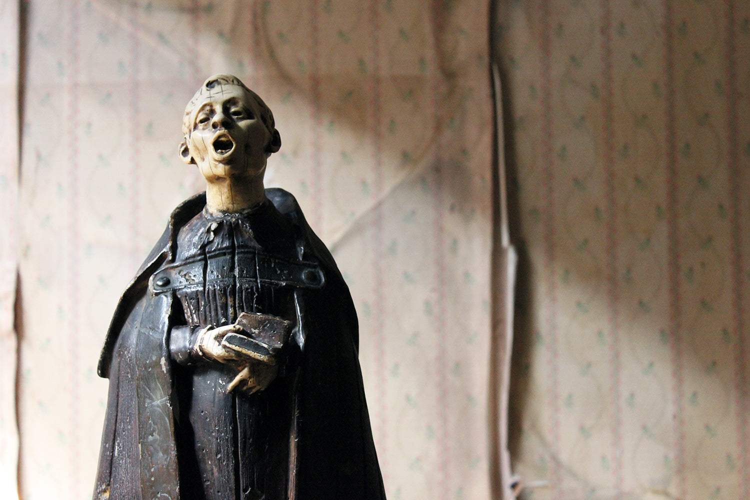 A 19thC Italian Painted Ceramic Figure of a Chanting Monk