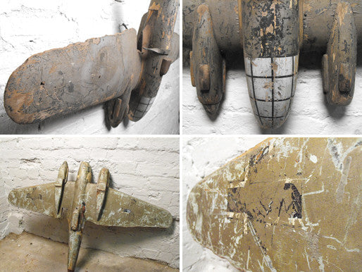 A Delightful Early 20thC Carved Wooden Polychrome Fairground Luftwaffe HE111 Aeroplane From a Round Spinner Stall