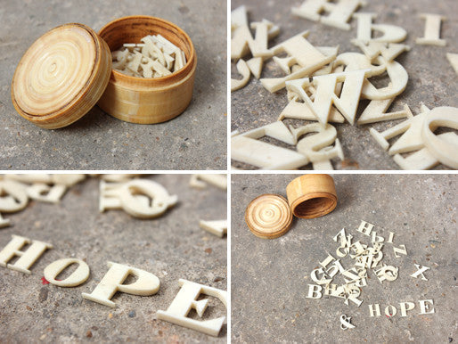 A Fine c.1860 Collection of Carved Bone Alphabet Letters Within a Turned Ivory Box
