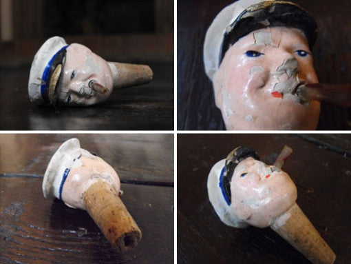 A 1920's Papier-Mache & Cork Bottle Stopper of Winston Churchill