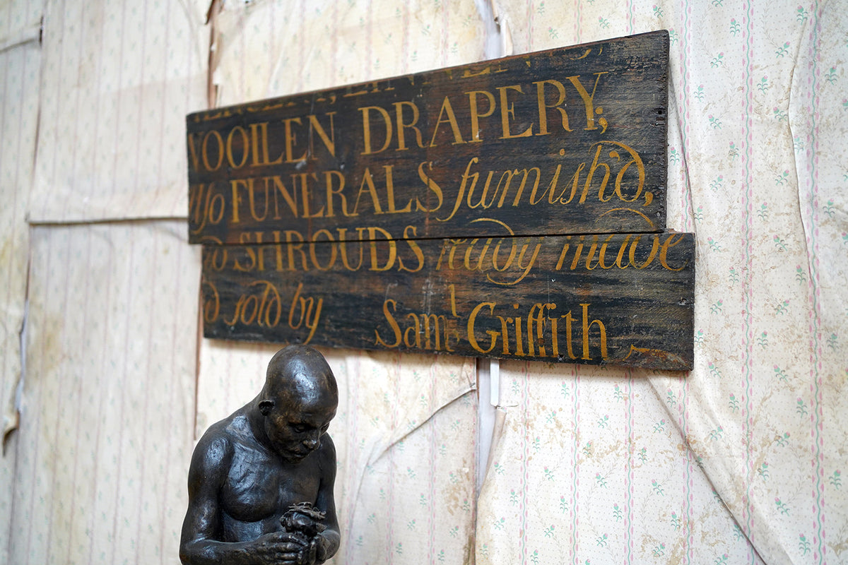 A Fragmentary Early-Victorian Painted Pine Drapers & Undertakers Sign c.1850-60