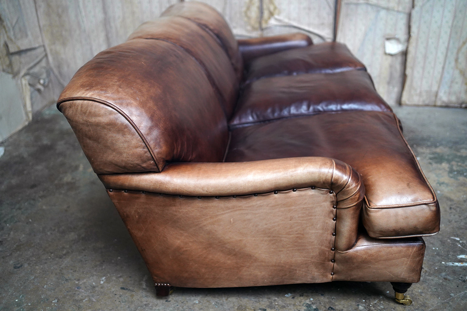 A Good Late 20thC Tan Leather Upholstered Sofa in the Manner of Howard & Sons