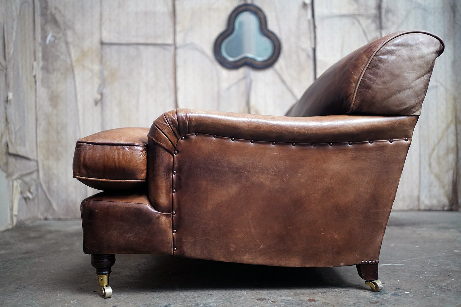 A Good Late 20thC Tan Leather Upholstered Sofa in the Manner of Howard & Sons