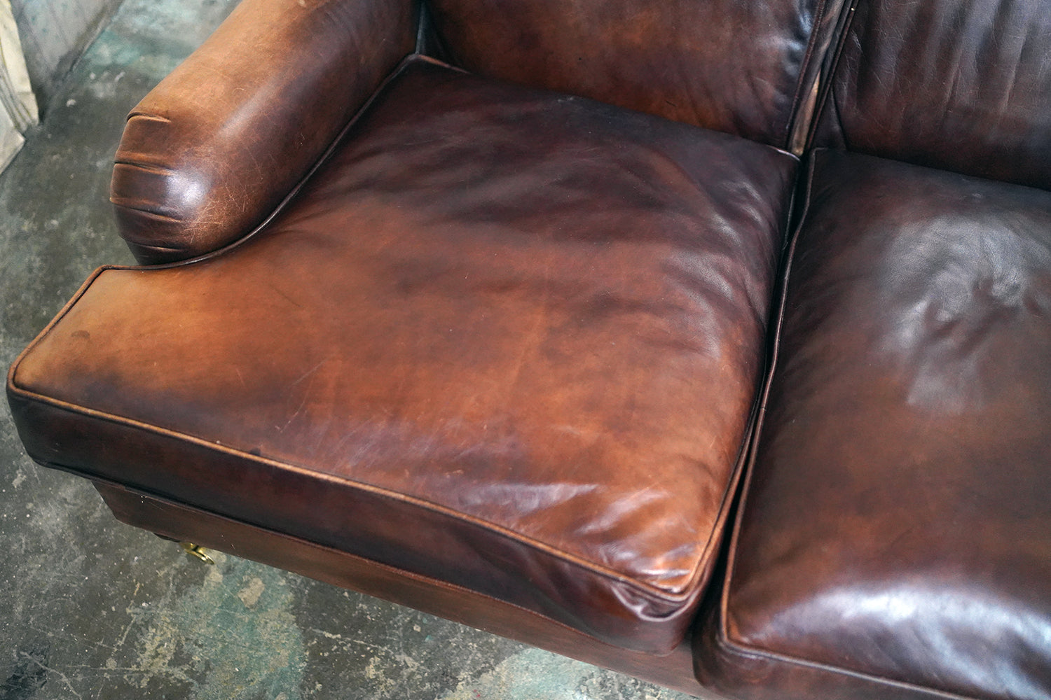 A Good Late 20thC Tan Leather Upholstered Sofa in the Manner of Howard & Sons