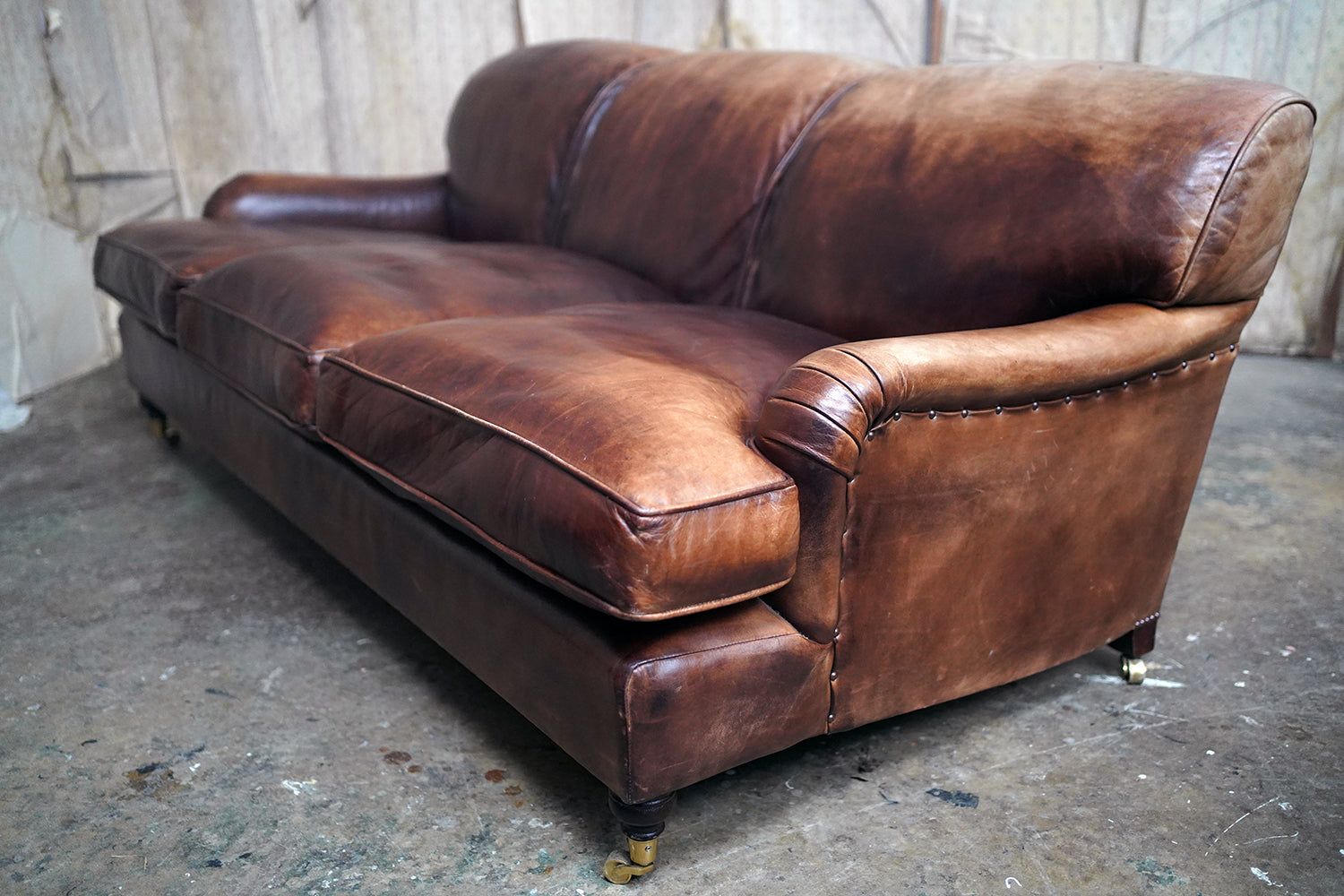 A Good Late 20thC Tan Leather Upholstered Sofa in the Manner of Howard & Sons