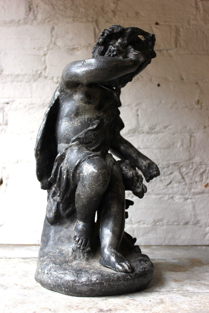 A Beautiful George III Period Lead Garden Ornament Cast as a Bacchanalian Putto