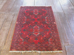 A Durable Red Afghan Rug: 119cm x 77cm