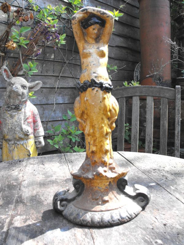 A Beautiful Painted Cast Iron Figural Door Stop of a Scantily Dressed Lady