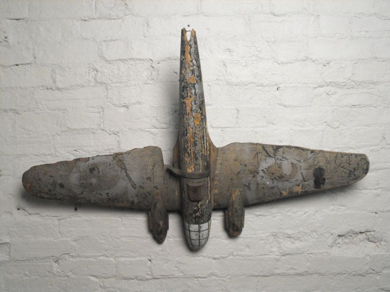 A Delightful Early 20thC Carved Wooden Polychrome Fairground Luftwaffe HE111 Aeroplane From a Round Spinner Stall