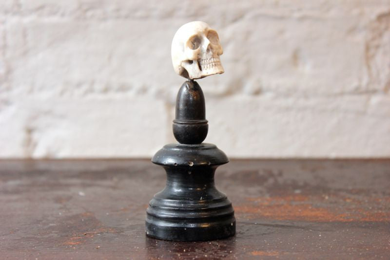 A Curious Early 20thC Miniature Carved Bone Model of a Human Skull Upon an Ebonised Column