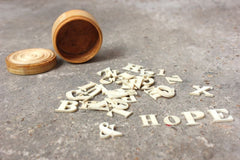 A Fine c.1860 Collection of Carved Bone Alphabet Letters Within a Turned Ivory Box