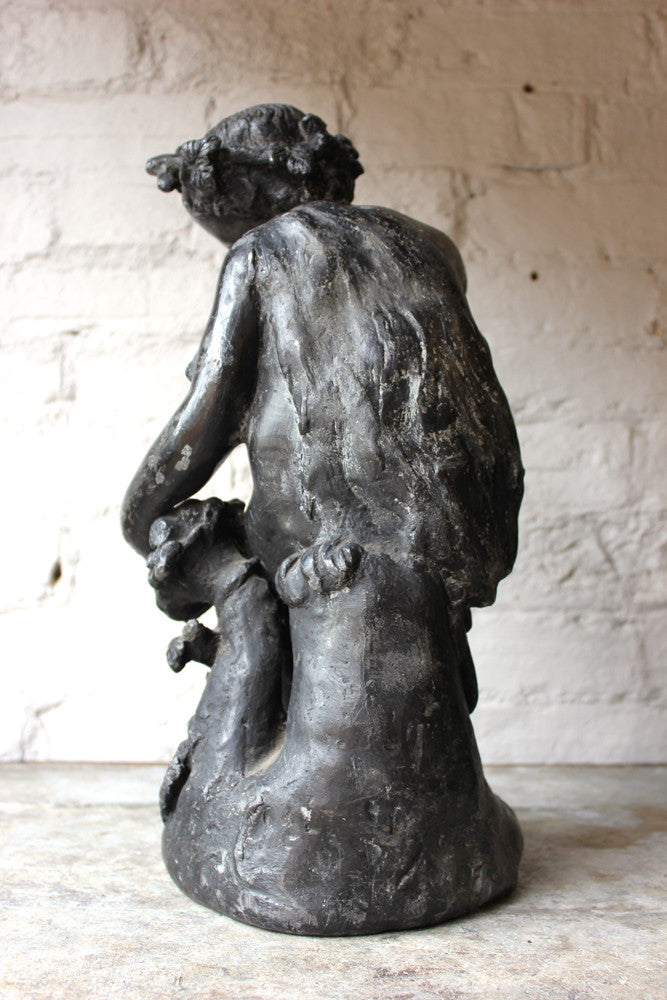 A Beautiful George III Period Lead Garden Ornament Cast as a Bacchanalian Putto
