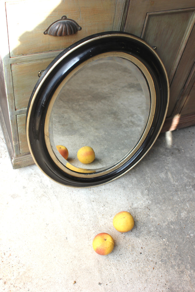 A Decorative c.1880 Ebonised Oval Wall Mirror