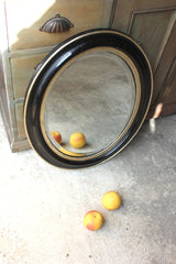 A Decorative c.1880 Ebonised Oval Wall Mirror