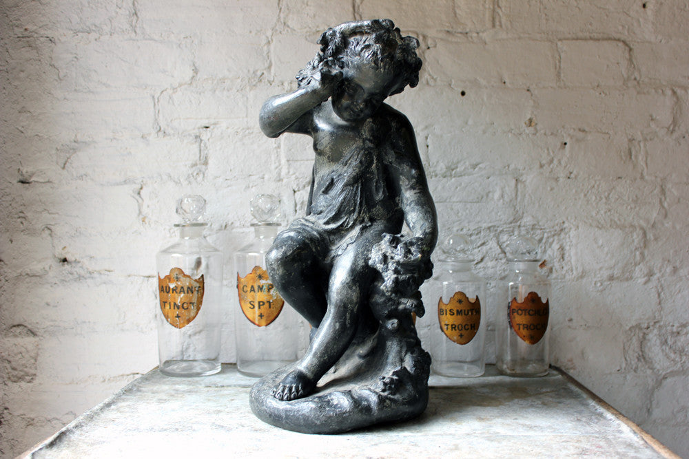 A Beautiful George III Period Lead Garden Ornament Cast as a Bacchanalian Putto