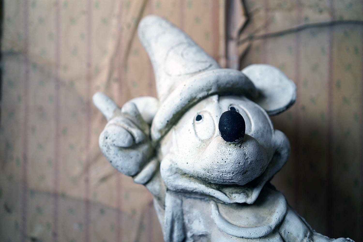 A 20thC Stone Figure of Mickey Mouse; The Sorcerer's Apprentice in Fantasia