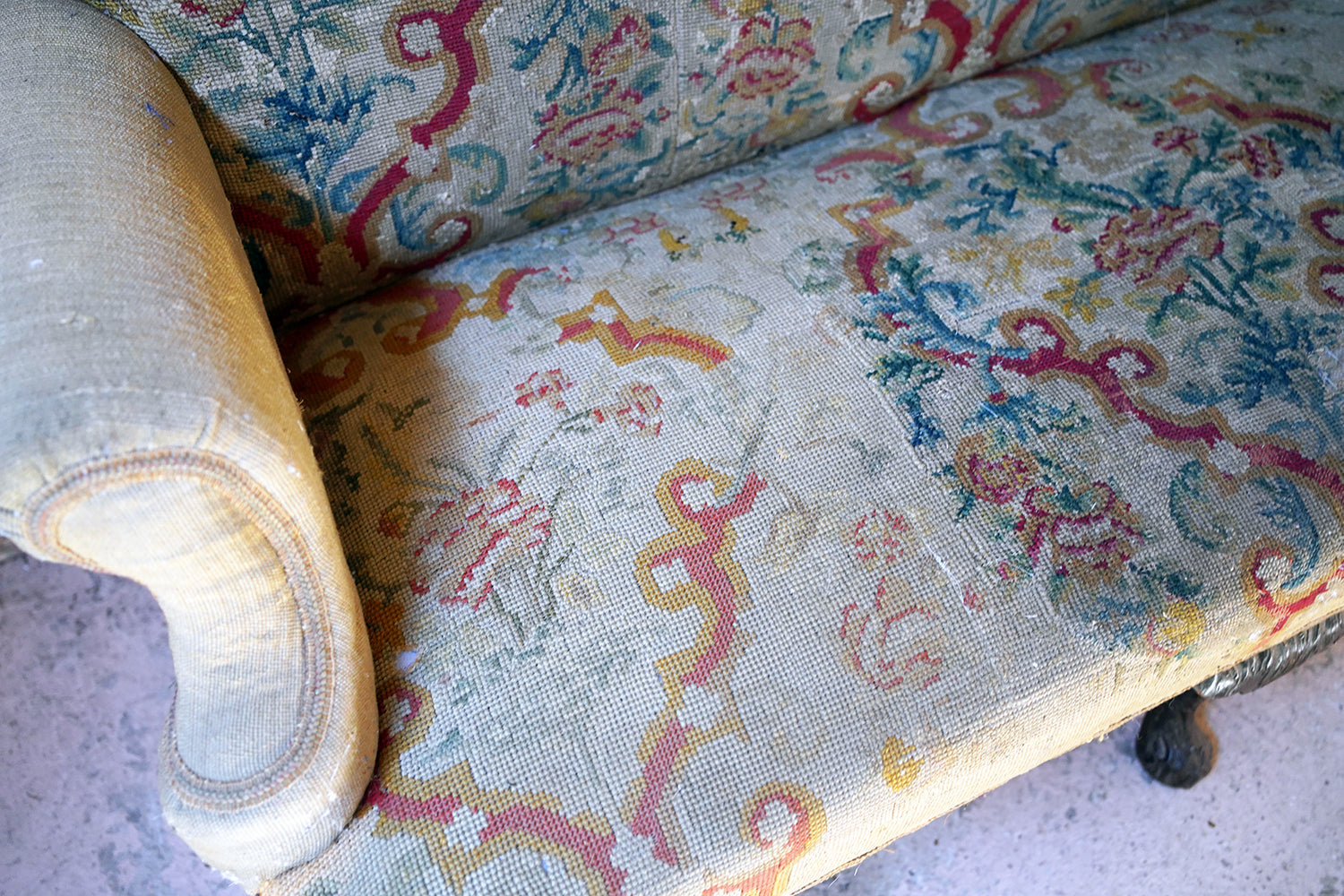 A George III Walnut Needlepoint Tapestry Upholstered Settee