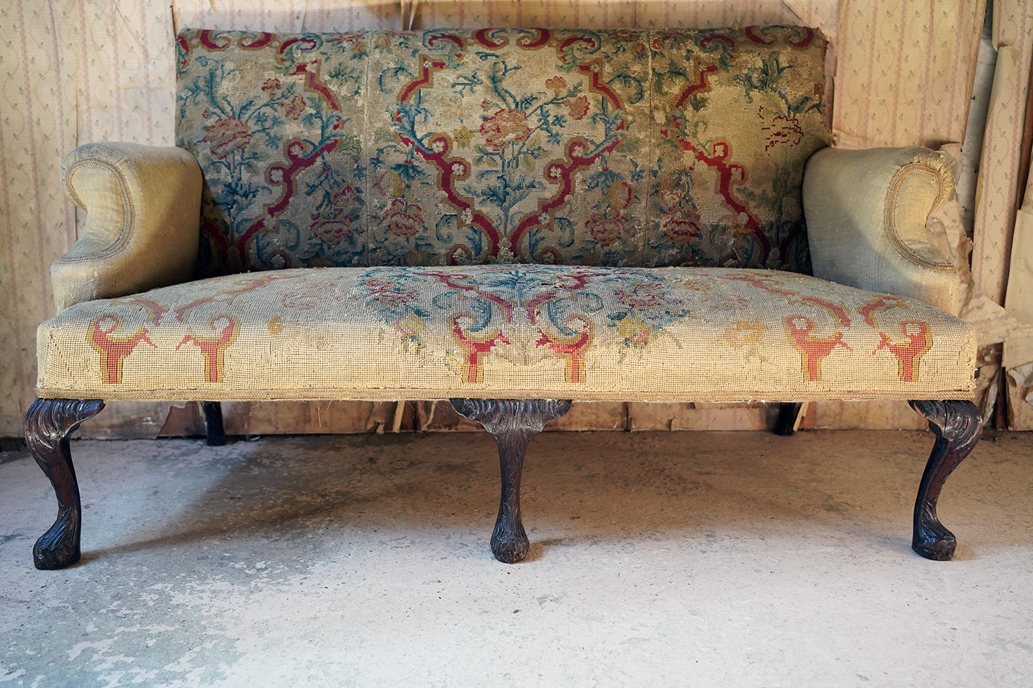 A George III Walnut Needlepoint Tapestry Upholstered Settee