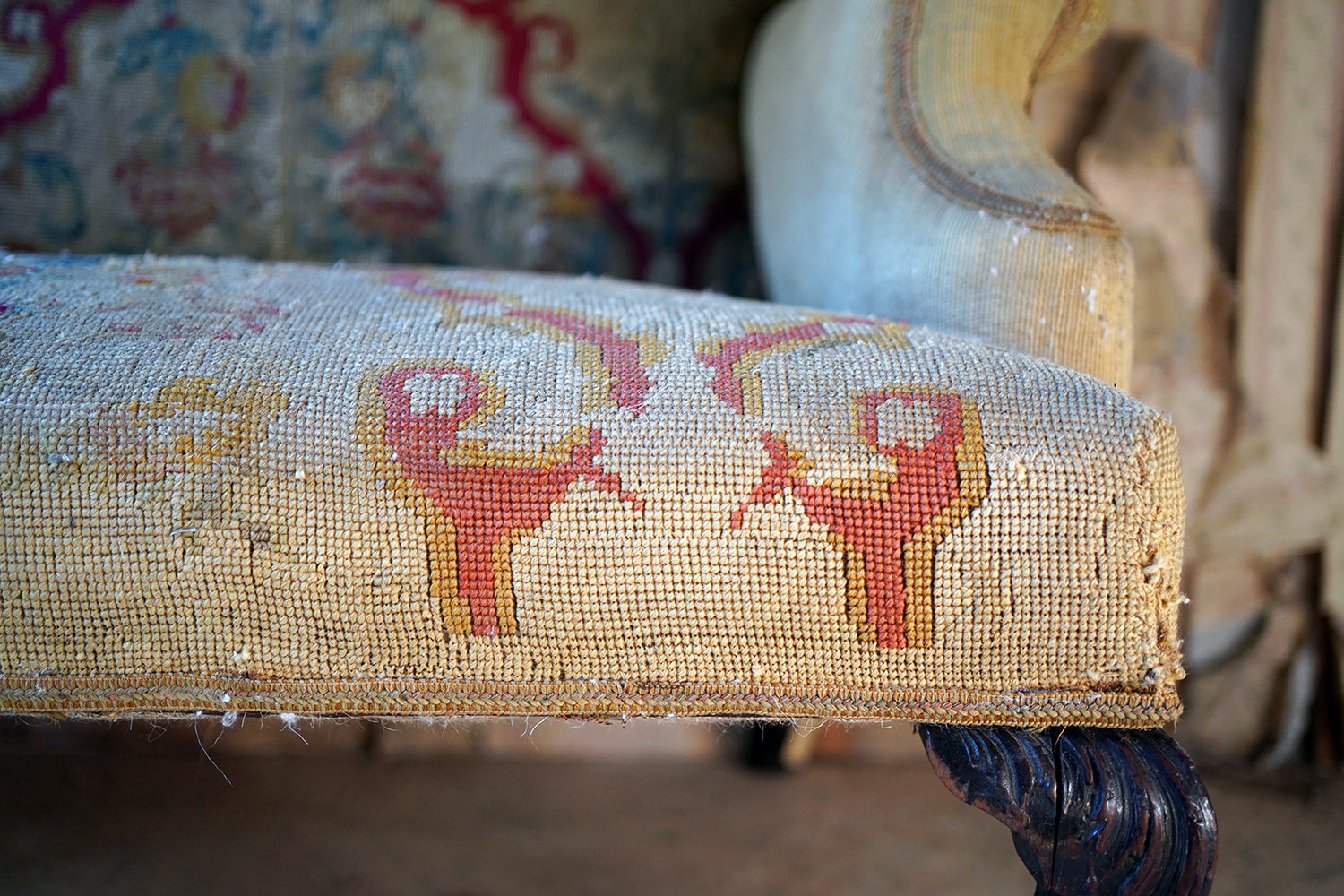 A George III Walnut Needlepoint Tapestry Upholstered Settee