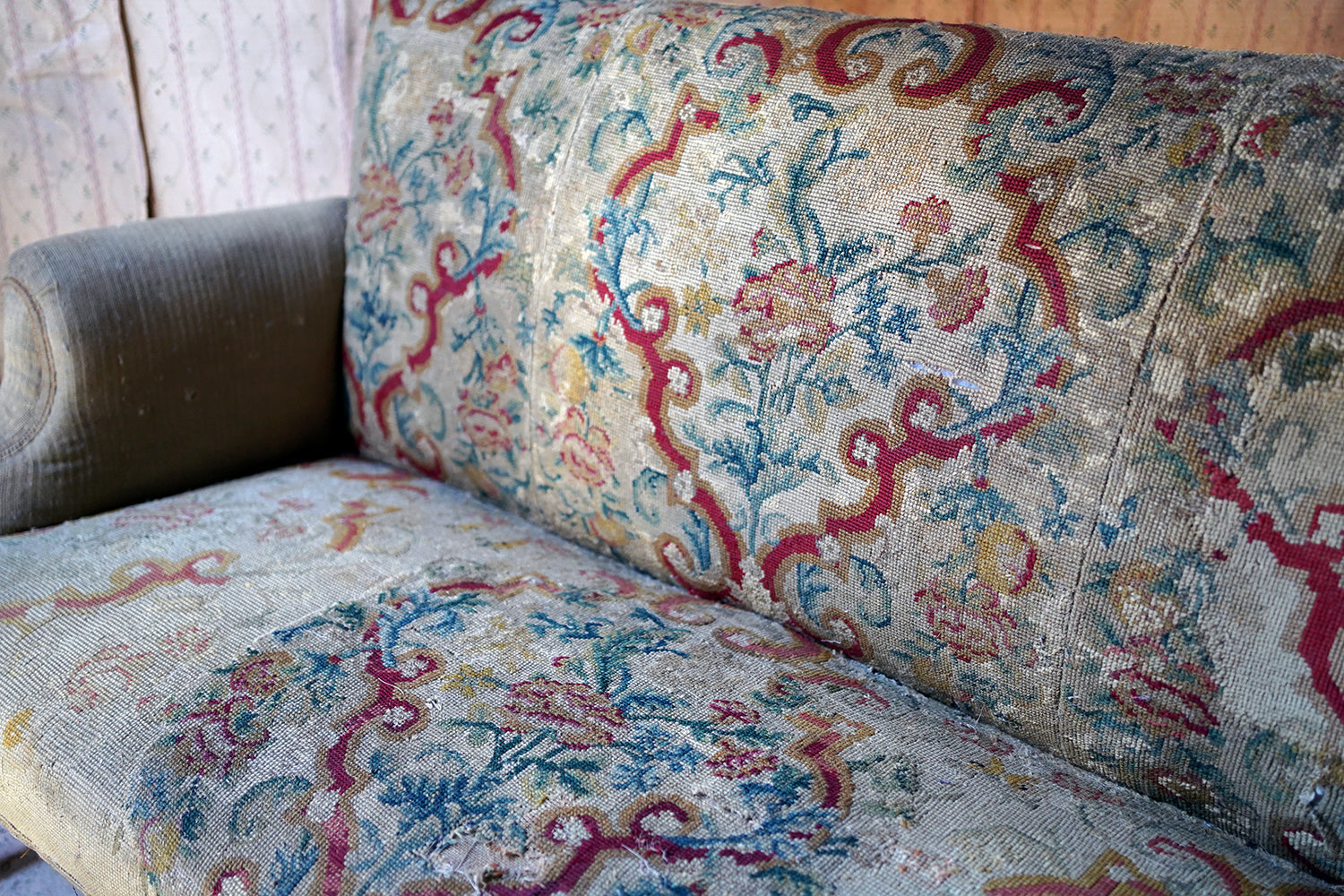 A George III Walnut Needlepoint Tapestry Upholstered Settee