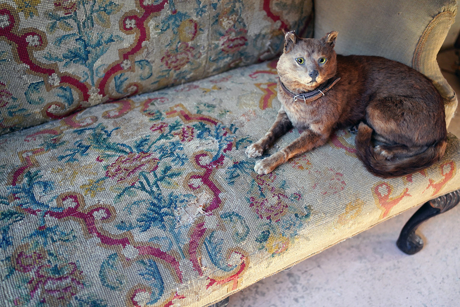 A George III Walnut Needlepoint Tapestry Upholstered Settee