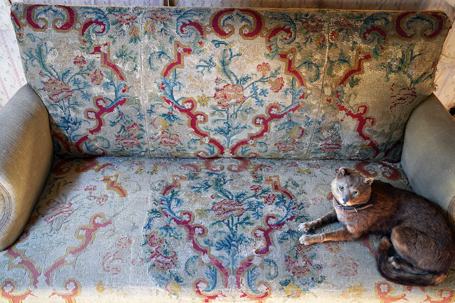 A George III Walnut Needlepoint Tapestry Upholstered Settee