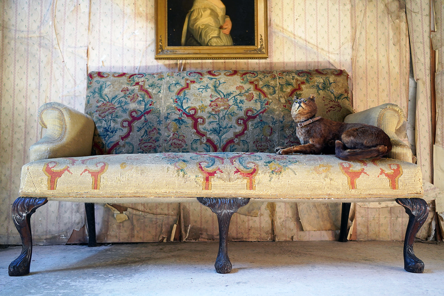 A George III Walnut Needlepoint Tapestry Upholstered Settee