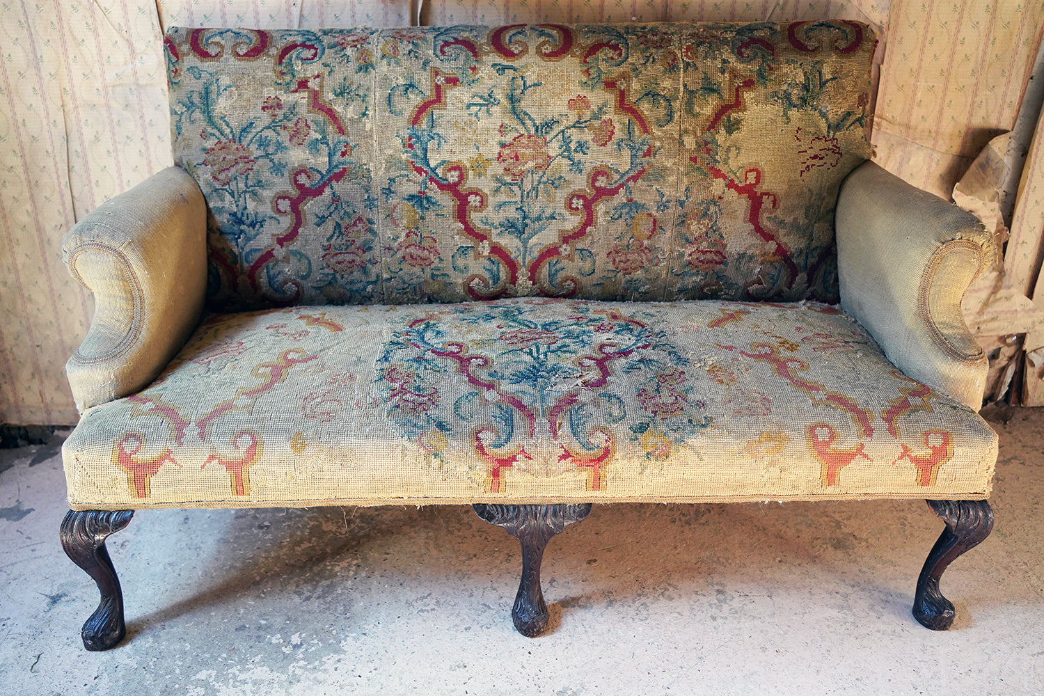 A George III Walnut Needlepoint Tapestry Upholstered Settee