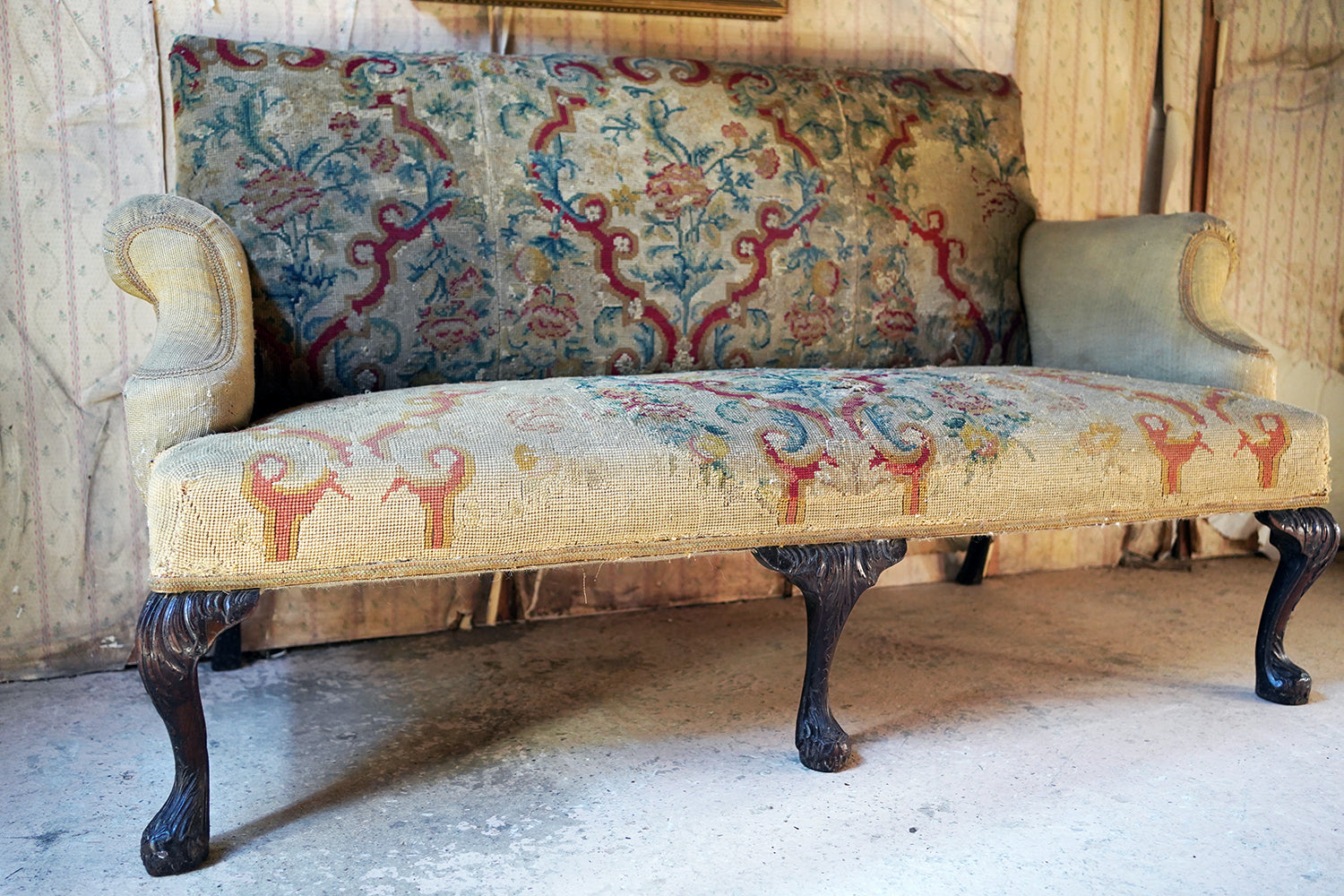 A George III Walnut Needlepoint Tapestry Upholstered Settee
