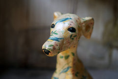 A 20thC Painted Plaster Model of a Hound