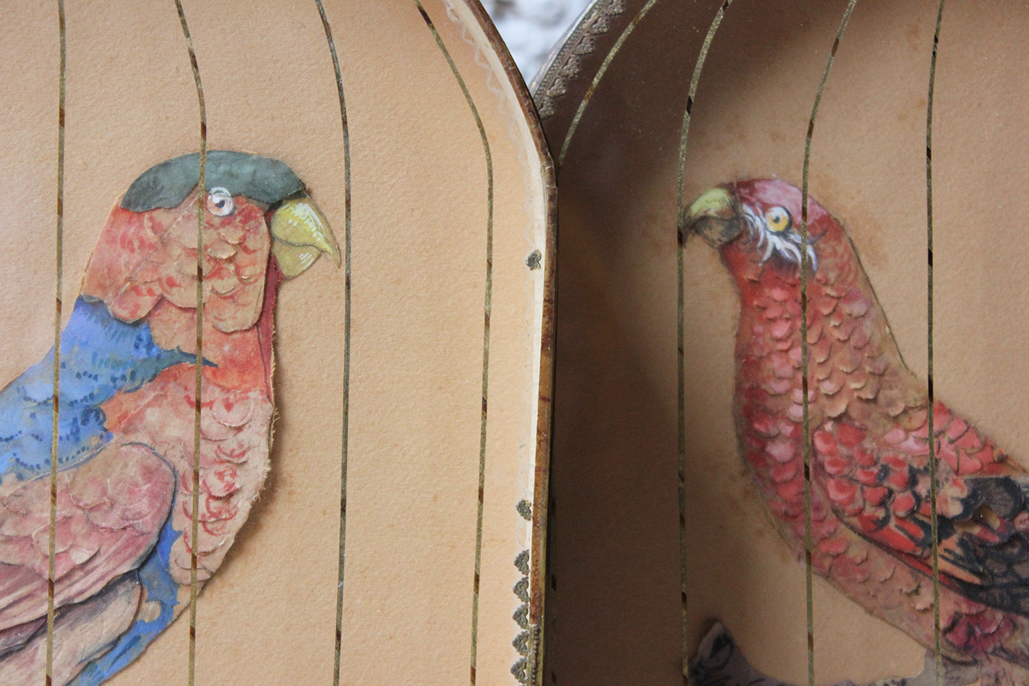 A Charming & Unusual Pair of Early 19thC Continental Appliqué Paper Pictures In The Form of Caged African Parrots c.1800-25