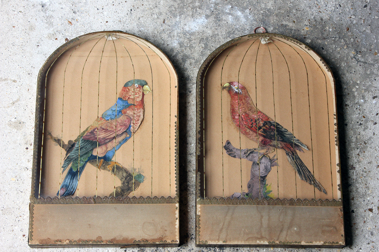 A Charming & Unusual Pair of Early 19thC Continental Appliqué Paper Pictures In The Form of Caged African Parrots c.1800-25