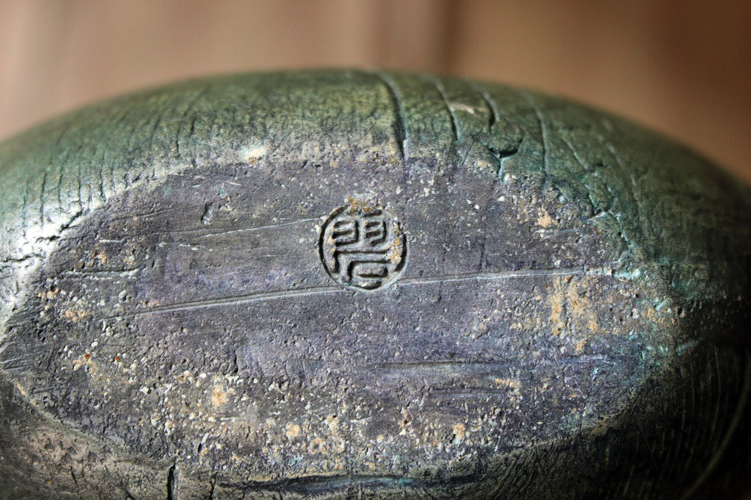 A Burnished Jade Green Bottle Vase by Peter Hayes c.1984