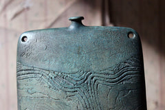 A Burnished Jade Green Bottle Vase by Peter Hayes c.1984