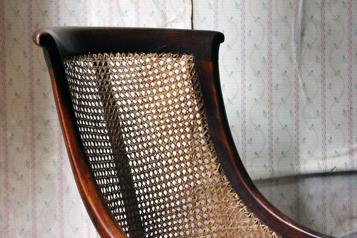 A Blacksmith Repaired Regency Mahogany Library Bergere Chair c.1815