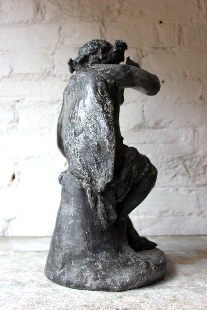 A Beautiful George III Period Lead Garden Ornament Cast as a Bacchanalian Putto