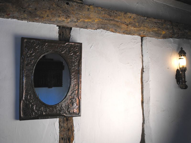 A Beautiful Arts and Crafts Embossed Copper Framed Wall Mirror