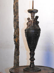 A Classical Form Spelter Lamp with Putti & Grapes above Bacchus Heads