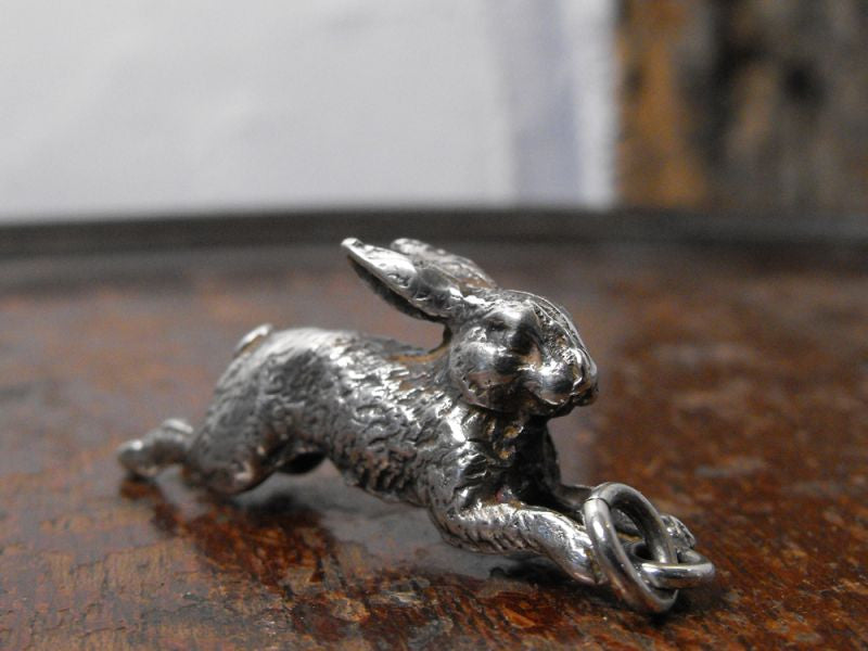 A Delightful Cast Silver Plate Charm Pendant Formed as a Running Hare